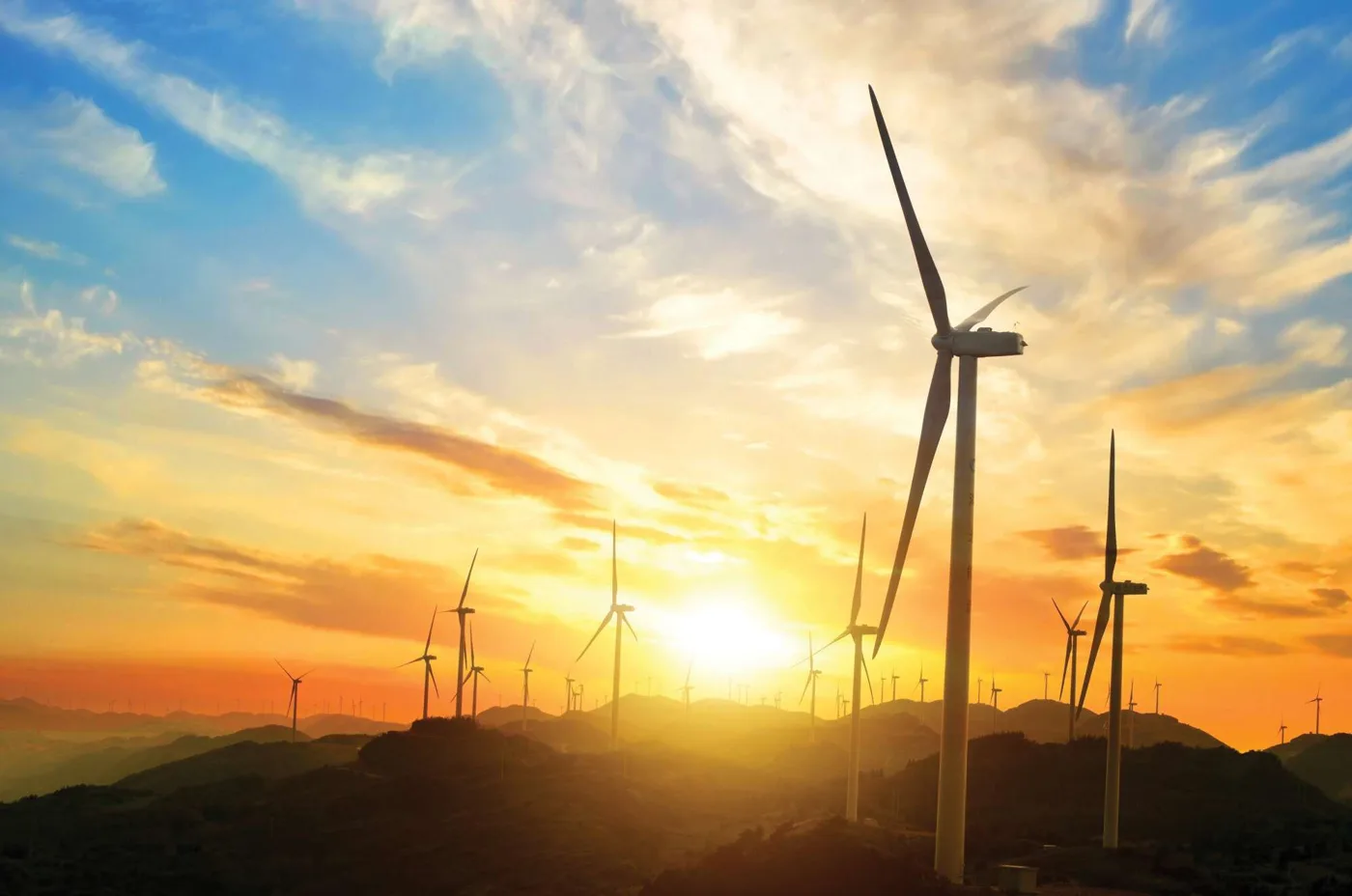 Wind turbines at sunset (contextual image)